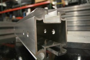 Close up of the end piece of a Uni-keder in a warehouse. Focal point is on the very end. Everything behind it is blurred.