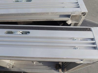 Close up of the locking mechanism, extrusion channel, and velcro rim, in a UNI-DEC stage deck.