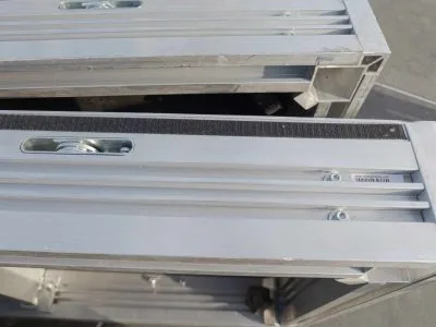 Close up of the locking mechanism, extrusion channel, and velcro rim, in a UNI-DEC stage deck.
